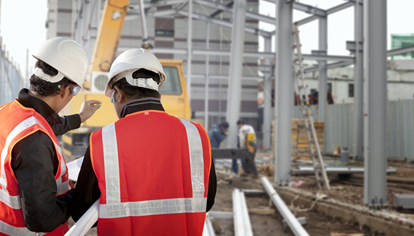 Construction site with two engineers Construction site with two engineers